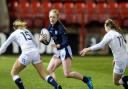 Megan Gaffney in action for Scotland against England at Broadwood in 2016 in front of a crowd of hundreds