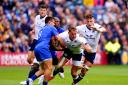Duhan van der Merwe is tackled during Scotland's clash with France last year