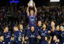 Scotland doctor James Robson lifts the Calcutta Cup on the shoulders of Pierre Schoeman as he bids farewell to Murrayfield after more than 30 years as Scotland team doctor